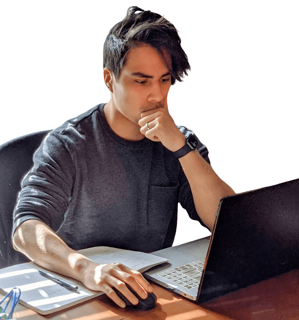 Headshot of me, at my desk, trying to look thoughtful and professional.